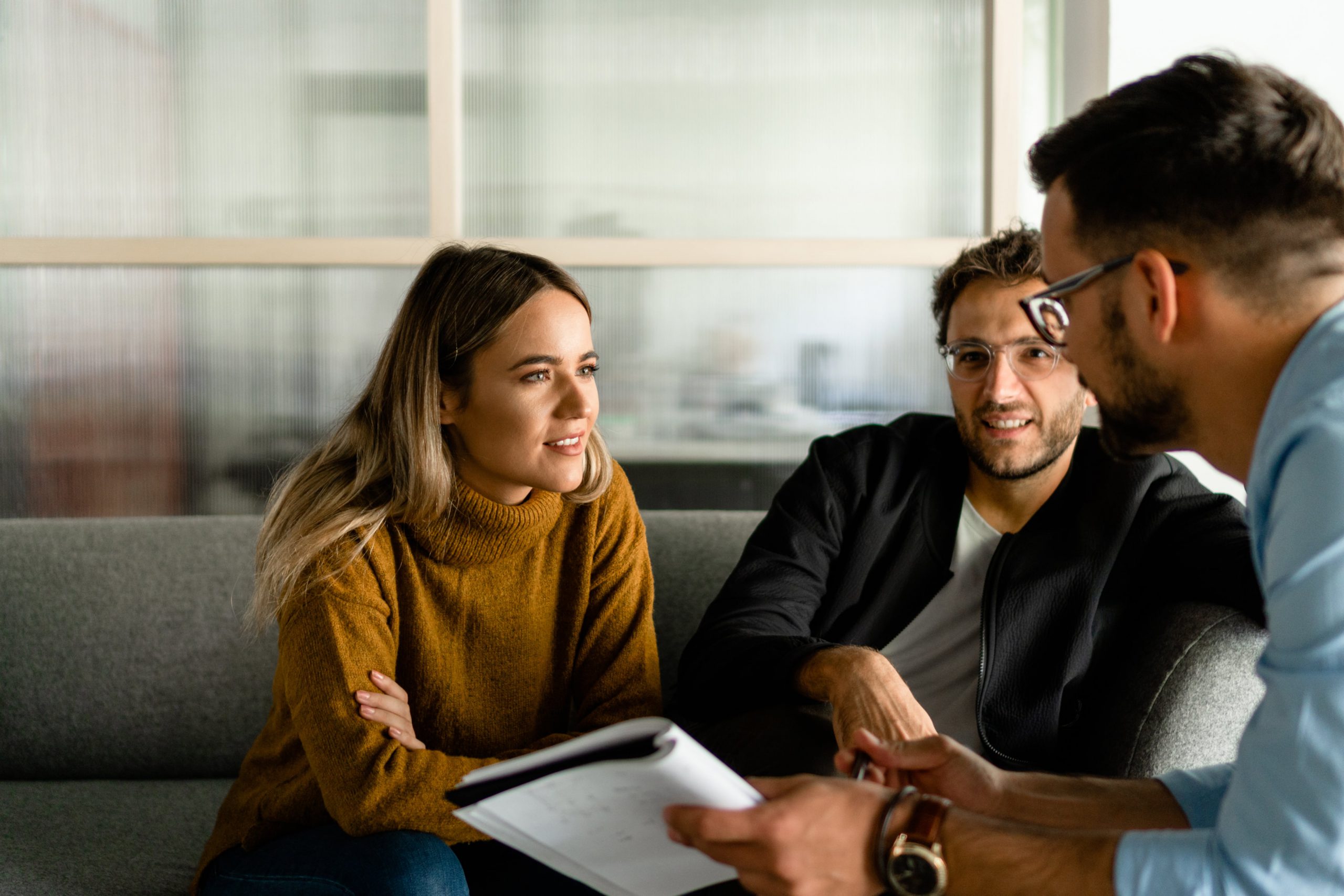 Young male and female couple receiving simple mortgage advice